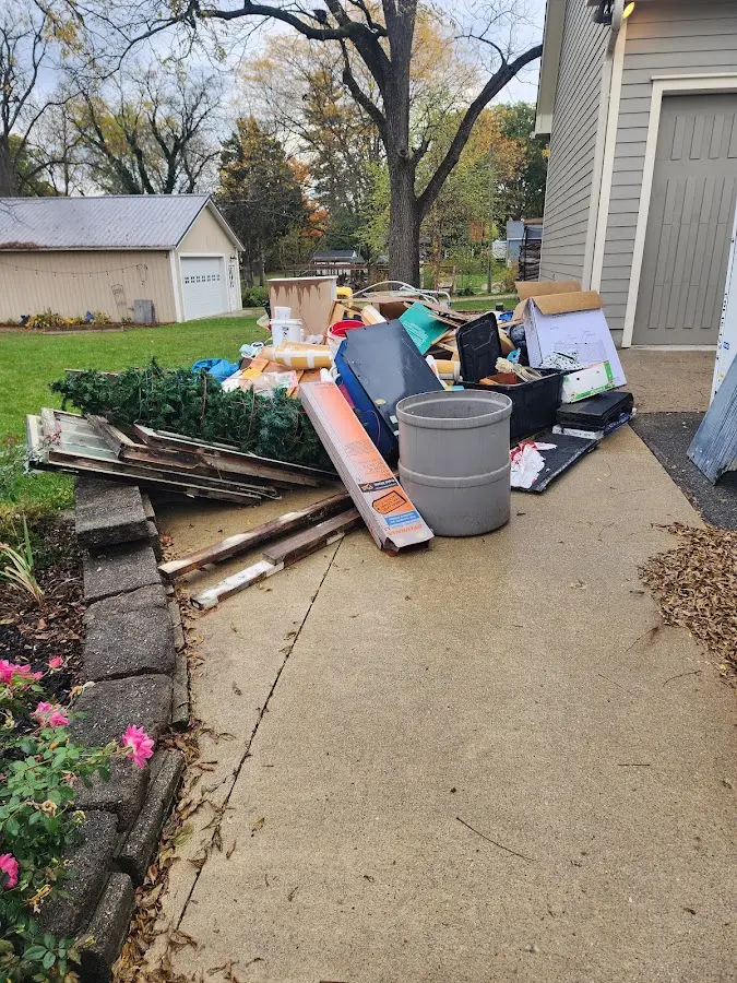 Dumpster being loaded with debris for 30 Yard Dumpster Rental in Pleasant Hills